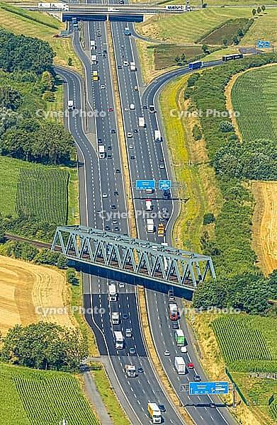 Aerial view, A2 motorway near Kamener Kreuz motorway junction, highway A1 and motorway A2, road traffic and truck traffic, Kamen, railway bridge, bridges, Ruhr area, North Rhine-Westphalia, Germany, motorway, BAB, motorway junction, air suspension, overvi [IBR113322312]