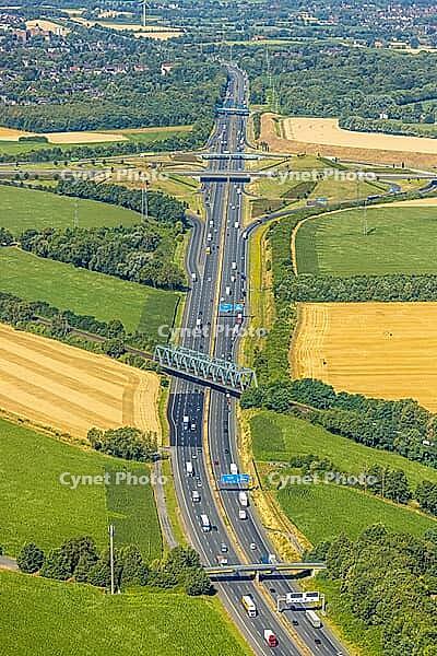 Aerial view, A2 motorway near Kamener Kreuz motorway junction, highway A1 and motorway A2, road traffic and truck traffic, Kamen, railway bridge, bridges, Ruhr area, North Rhine-Westphalia, Germany, motorway, BAB, motorway junction, air suspension, overvi [IBR113322323]