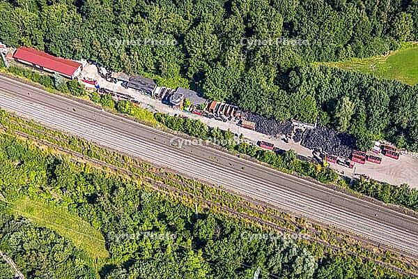 Aerial view, tire storage and tire recycling Arnold an der Werner Straße, railway tracks, commercial space, old tires, Bergkamen, Ruhr area, North Rhine-Westphalia, Germany, birds-eyes view, aerial photography, aerial photography, overview, bird's eye vie [IBR113322368]