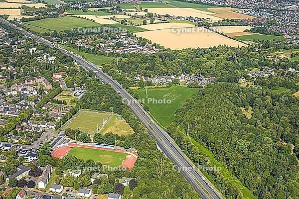 Aerial view, A2 motorway, possible and planned route for regional railway between Kamen and Bergkamen, Jahnstadion, soccer player on the side square, railway infrastructure, road traffic and truck traffic, Kamen, Ruhr area, North Rhine-Westphalia, Germany [IBR113322370]