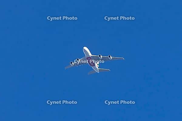 Airbus A380 jet passenger aircraft of Emirates airlines flying in a blue sky, England, United Kingdom [IBR125204161]