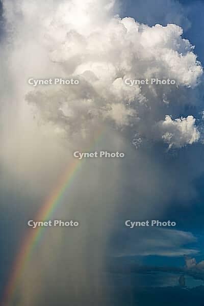 Rain and rainbow during the rainy season in the Kalahari Desert, Kgalagadi Transfrontier Park, South Africa [IBR125204169]