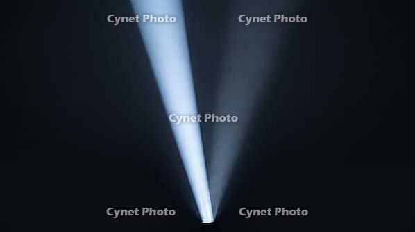 Abstract light beam splitting into two diverging paths, one bright one fading, dark background, studio shot, AI generated [IBR125211523]