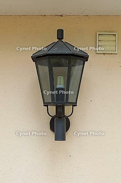Traditional black outdoor wall lantern designed for exterior house walls and entrance lighting, Finland [IBR125242393]