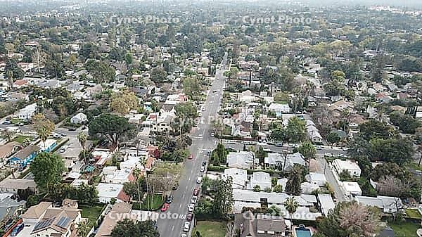 Aerial view of a residential neighborhood with houses, trees, and streets under a cloudy sky, Alta Dena, California, USA [IBR125242398]