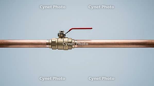 Ordinary copper pipe with a closed shutoff valve, calm exterior hiding the violent pressure transient of water hammer, studio shot, AI generated [IBR125242473]