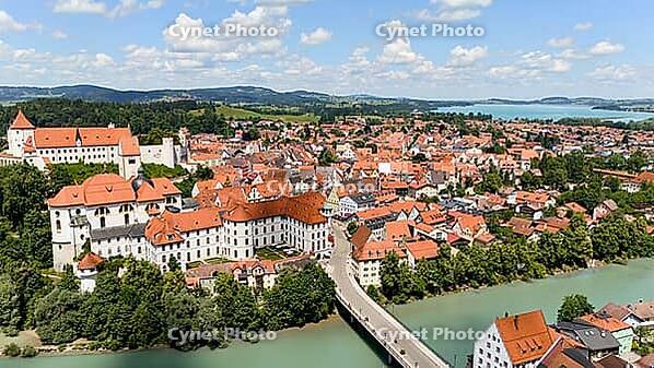 Drone view of red rooftops and river in European town [IBR125261565]