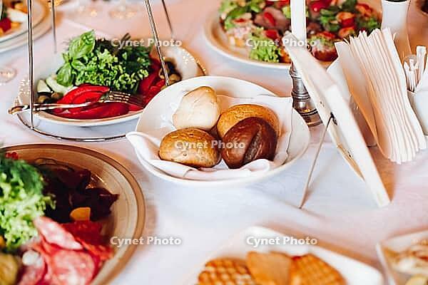 Close-up of delicious meat balls and fish rolls catered on rectangular balls with sticks for snacks. Variety of food on birthday corporate party or wedding celebration [IBR125261610]