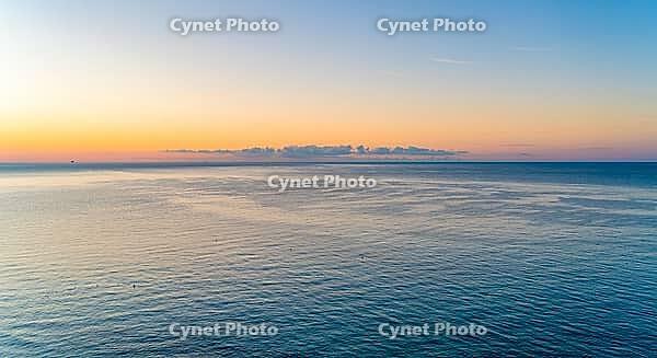 Sundown over sea seen in Liguria, an area in Italy [IBR125280308]