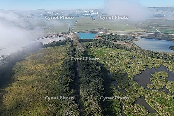 Aerial view of the sand extraction port on the banks of the Paraiba River in the Paraiba Valley, Sao Paulo, Brazil. [IBR125280317]