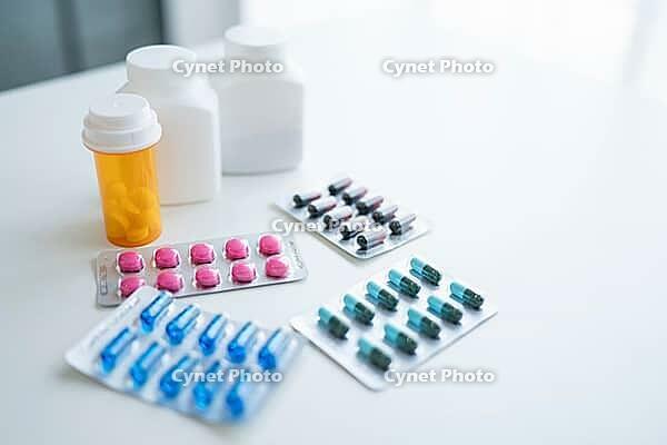 Pills and capsules on white background Medical and pharmaceutical concept representing healthcare treatment prevention and wellness [IBR125280318]