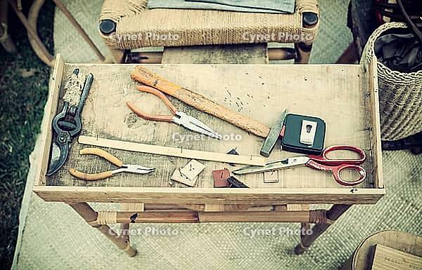 Tools for handicraft work on wooden table [IBR125280330]