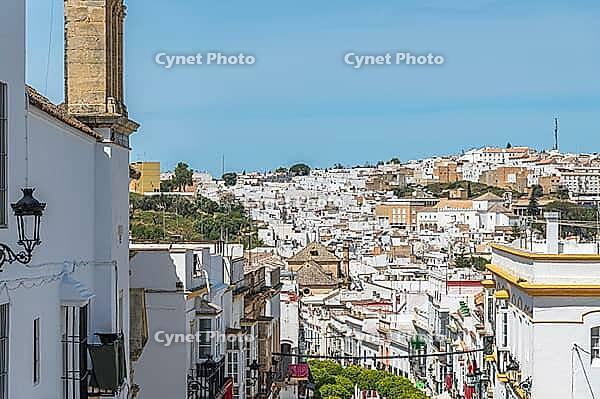 Narrow streets lined with whitewashed historic buildings in the old town of Arcos de la Frontera, Cadiz province, Andalusia, Spain, with colorful details and traditional character [IBR125280353]