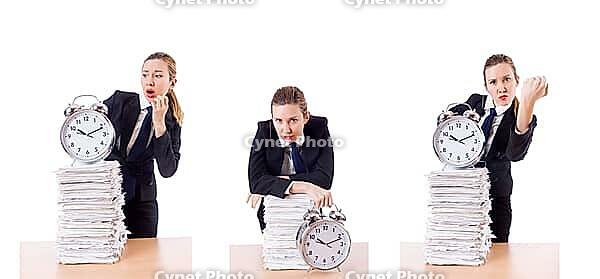 The businesswoman with watch and papers [IBR125304598]