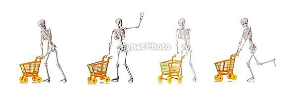 The skeleton with shopping cart against a white background [IBR125304644]