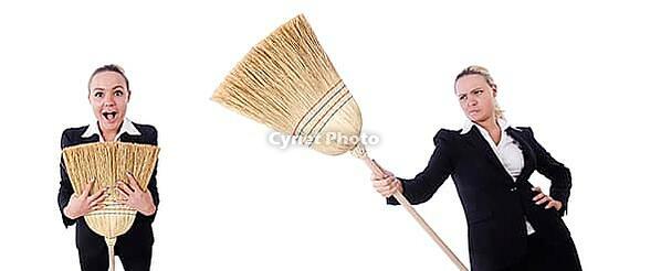 The businesswoman with a brush against a white background [IBR125324122]