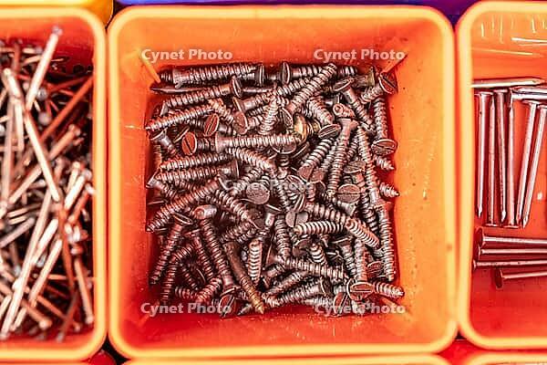 Steel nails used in carpentry. Accessories for mounting and connecting in boxes. Light background [IBR125324123]