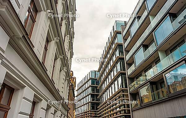 Architectural Contrast Old Facade Beside Modern Building [IBR125331172]