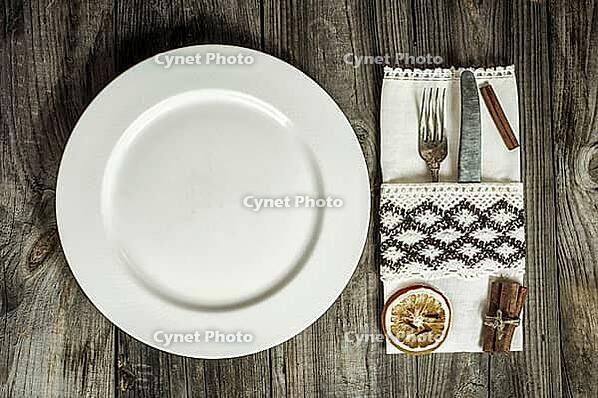 Plate with cutlery and napkin, creative vintage tableware, top view [IBR125331196]