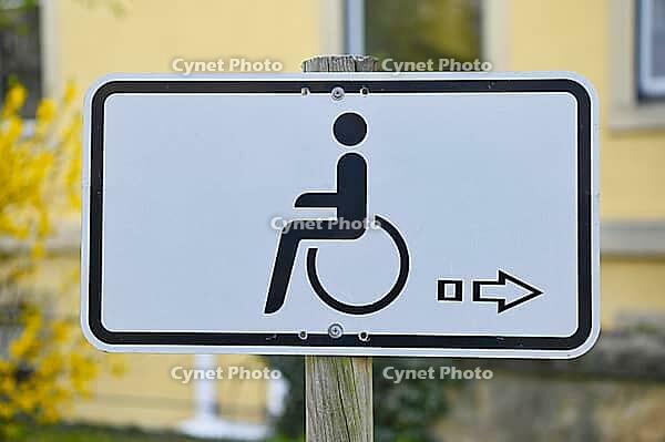 Parking sign in front of a hospital [IBR125344282]