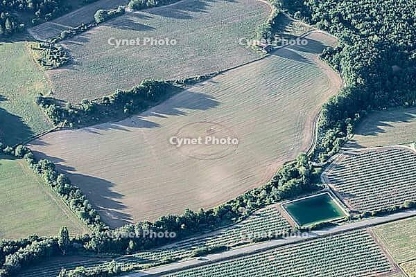 Humorous smiley emoticon on a harvested green field of Provence, France [IBR125344329]