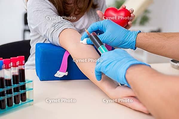 Young woman in blood transfusion concept [IBR125363593]