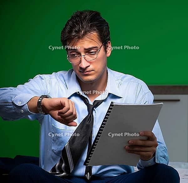 The young businessman is under stress in the bedroom at night [IBR125382575]