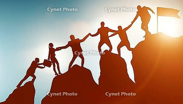 Concept of teamwork with the team climbing the mountain summit [IBR125382581]