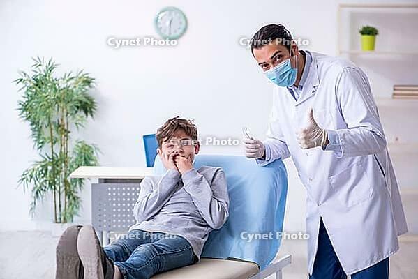 The boy visits doctor in hospital [IBR125382603]
