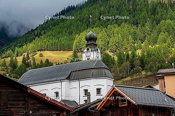 View of the parish church of the Nativity of Mary in Reckingen, Switzerland [IBR125382632]