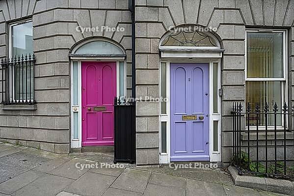 Dublin, Ireland. April 7, 2026. the brightly colored entrance doors to a building in the city center [IBR125382645]