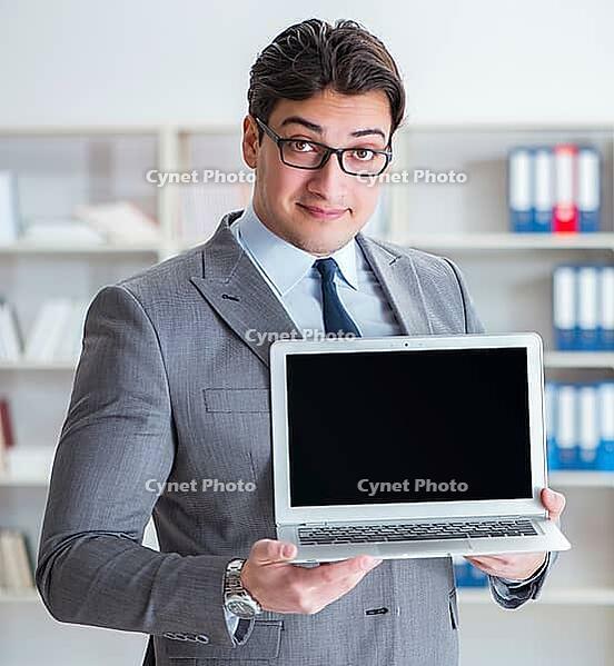 The young businessman works in the office [IBR125382652]