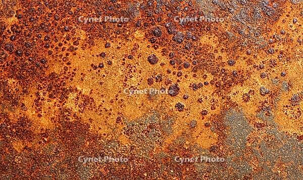 Flat rust texture on iron surface, natural oxidation pattern with orange and brown tones. AI generated [IBR125395920]