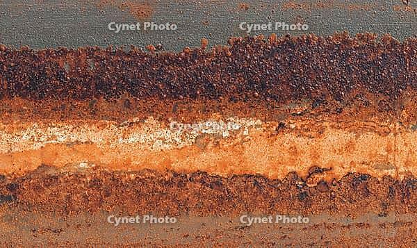Flat rust texture on iron surface, natural oxidation pattern with orange and brown tones. AI generated [IBR125395925]