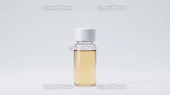 Single clear reference material vial with plain white cap, pale amber contents, seamless grey background, studio shot, AI generated [IBR125395932]