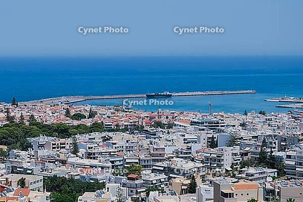 Panoramic view of the Greek city of Rethymno from a height on the island of Crete Greece. Residential buildings and the Aegean sea. [IBR125405004]