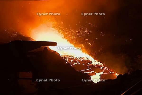 A stream of molten steel flowing from a blast furnace [IBR125405010]