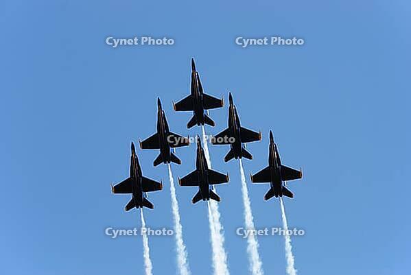 A formation of airplanes on a blue sky [IBR125405023]