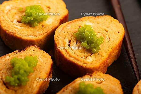 Japanese Tamagoyaki with Green Wasabi Caviar on Black Stone Board [IBR125405028]