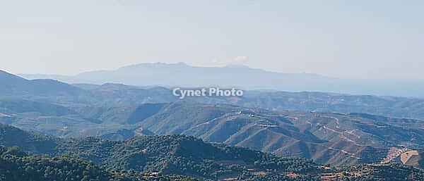 White Mountains in Crete on a Greek island, showing a scenic mountain landscape with characteristic Mediterranean terrain under clear sky [IBR125405032]