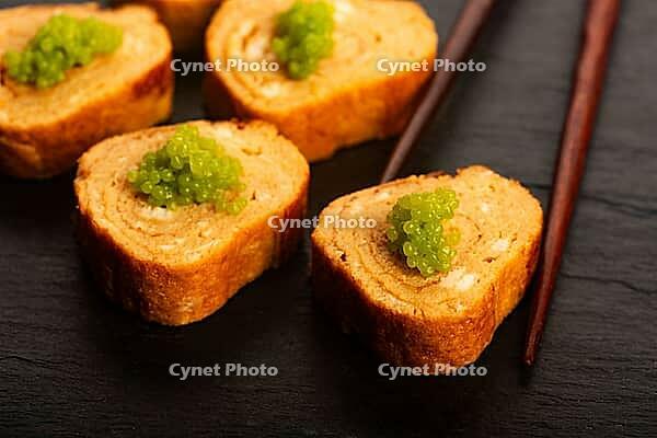Japanese Tamagoyaki with Green Wasabi Caviar on Black Stone Board [IBR125405036]