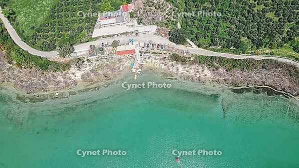 Lake Kournas in Crete aerial view of pedal boat rental clear water and scenic Greek nature on a sunny day [IBR125405047]