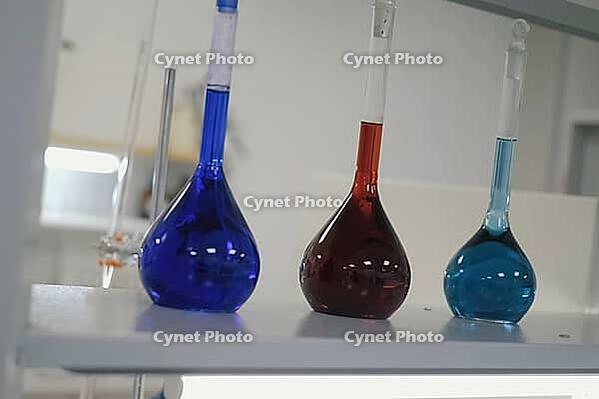 Test tubes and flasks with multi-colored liquids in the laboratory. Chemical reagents in the laboratory [IBR125405050]