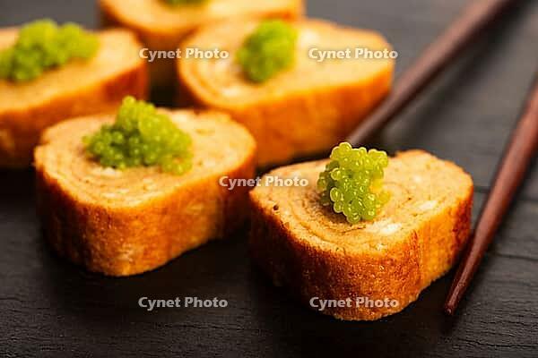 Japanese Tamagoyaki with Green Wasabi Caviar on Black Stone Board [IBR125405061]