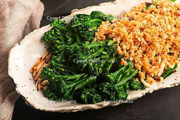Blanched Bimi Broccoli with Toasted Almonds, Butter and Breadcrumbs on Handmade Ceramic Plate [IBR125405065]