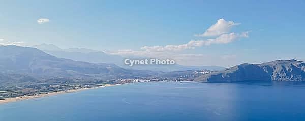 Paradise Greek island Crete from drone panoramic view in clear weather, showcasing coastline, villages and natural Mediterranean beauty in bright daylight [IBR125405076]