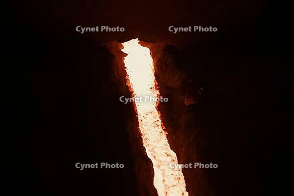 A stream of molten steel flowing from a blast furnace [IBR125405085]