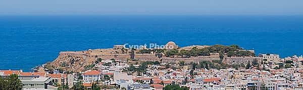 Panoramic view of the Greek city of Rethymno from a height on the island of Crete Greece. Residential buildings and the Aegean sea. [IBR125405089]