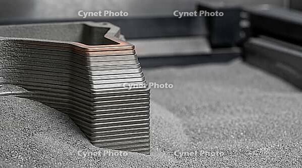 Close-up of a stepped metal object edge showing fine horizontal striated layers rising from a bed of grey powder, layer by layer additive manufacturing, industrial macro photography, AI generated [IBR125407420]