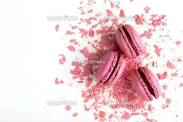 Pink rose french macarons on pastel background traditional dessert in France [IBR125411116]